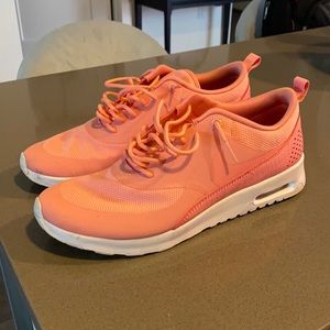 Coral colored Nike flex sneakers